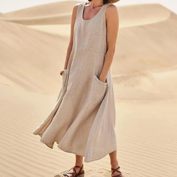 "Abito estivo in lino donna, design rilassato con tasche voluminose, perfetto per un look chic e confortevole."