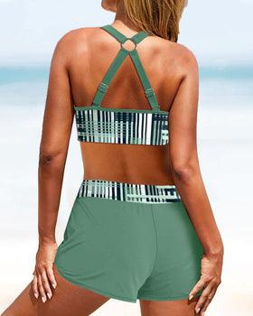 "Bikini donna a vita alta con motivo a strisce, silhouette elegante e copertura confortevole, ideale per spiaggia o piscina."