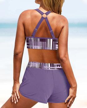 "Bikini donna a vita alta con motivo a strisce, silhouette elegante e copertura confortevole, ideale per spiaggia o piscina."