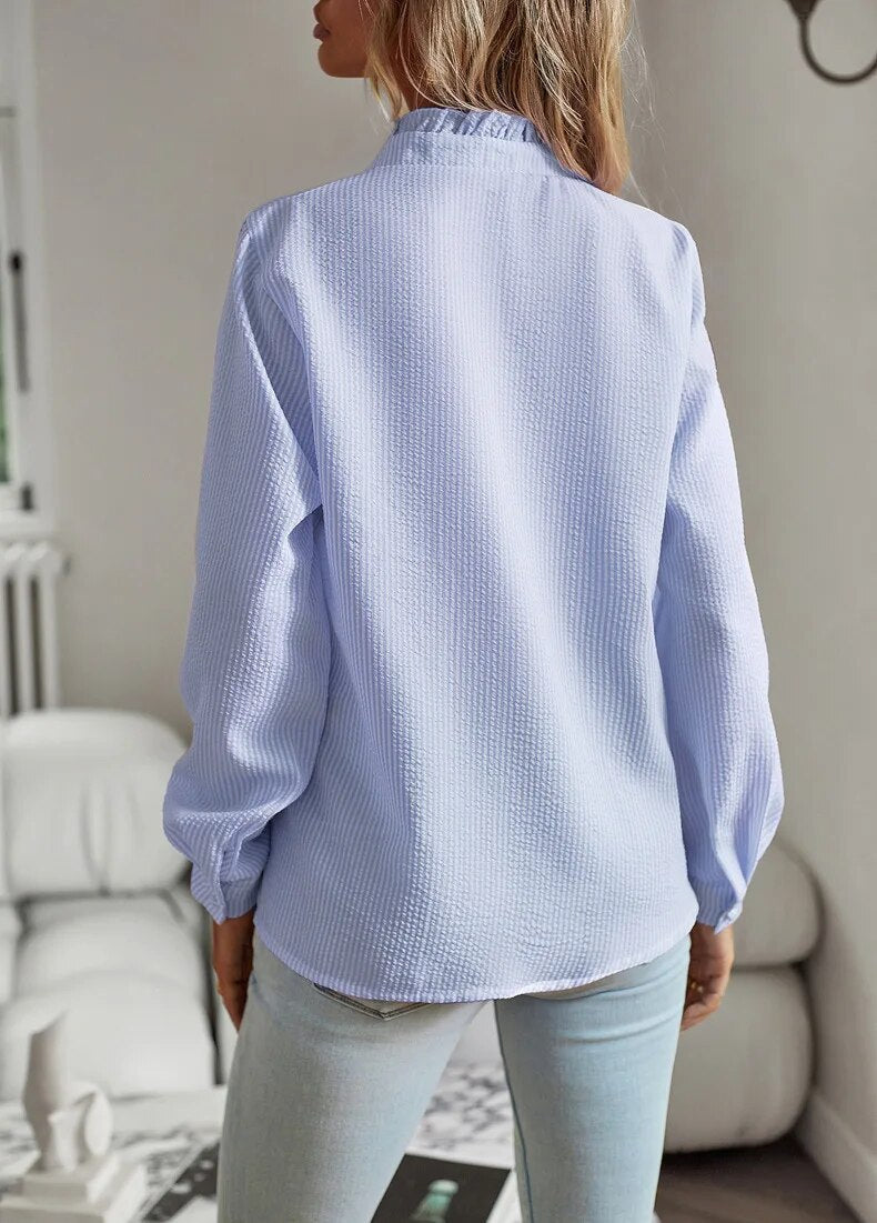 "Blusa donna drappeggiata in cotone con ruches eleganti, stile sofisticato, dettaglio femminile, disponibile in vari colori."