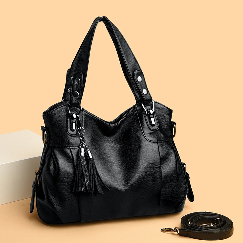 "Borsa a spalla elegante in pelle genuina; design robusto con chiusura zip e rivetti per stile e praticità."