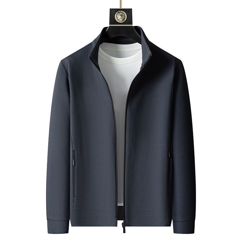 "Completo sportivo uomo: giacca a zip in tessuto leggero grigio, pantaloni con coulisse, ideale per palestra e outdoor."