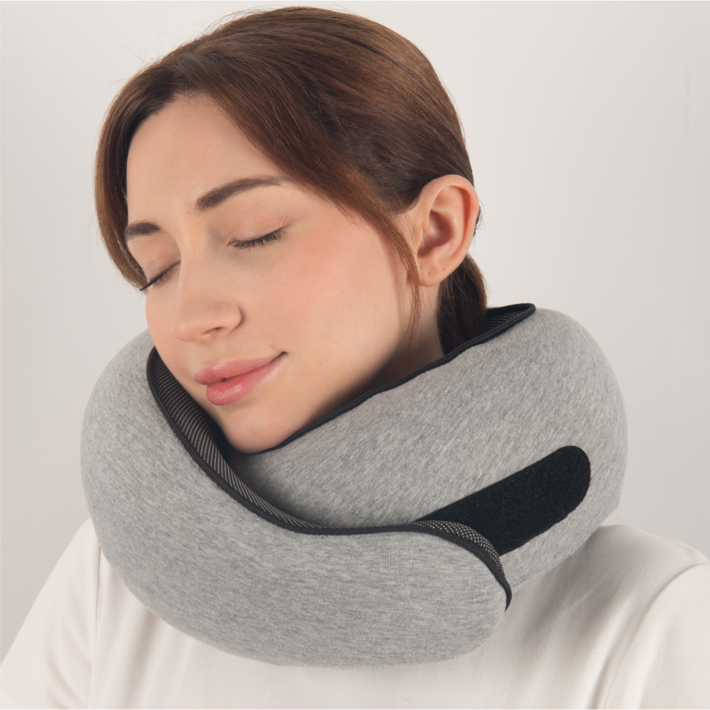 "Cuscino da viaggio unisex comodo e compatto, colore rosa, design ergonomico per supporto collo, ideale per viaggi lunghi."
