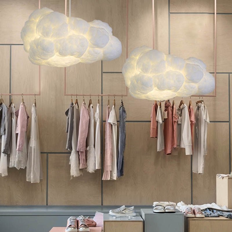 "Lampada a sospensione nuvola bianca moderna, luce soffusa, design elegante per interni contemporanei."