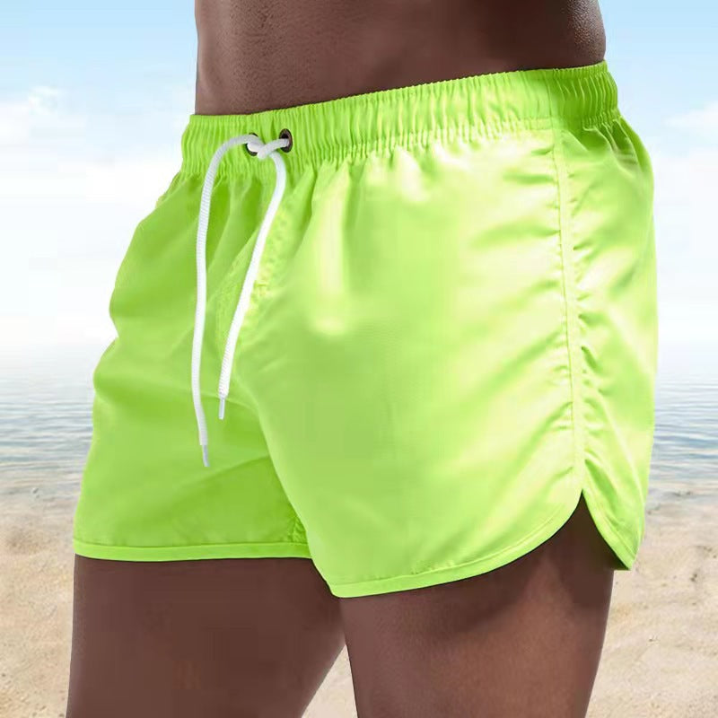 "Pantaloni da bagno uomo, asciugatura rapida, vivaci colori arancione, blu, verdi; elastico in vita, cordino regolabile"