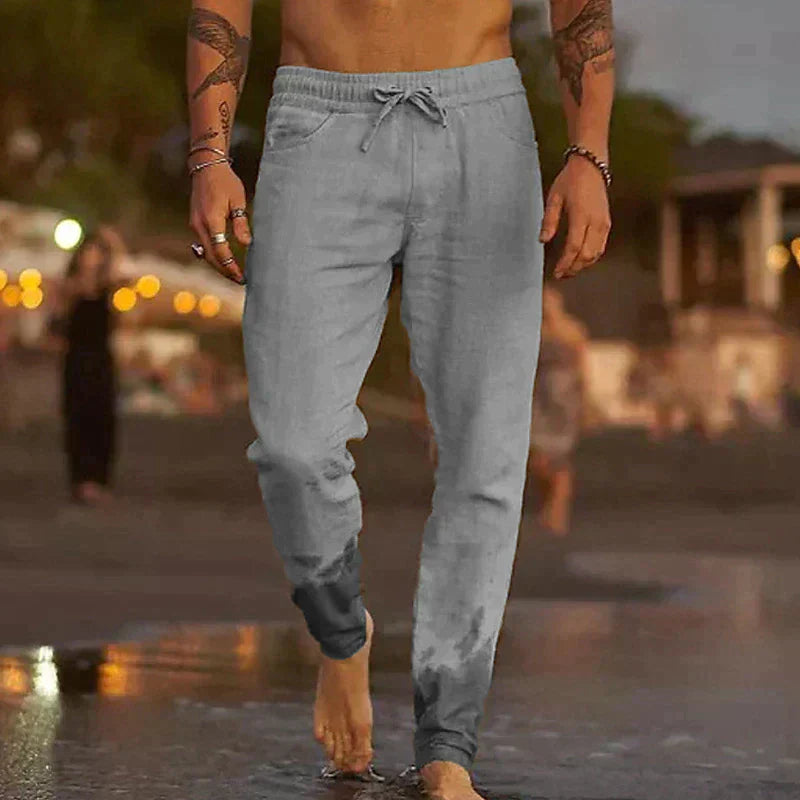 "Pantaloni leggeri in lino da uomo, beige chiaro, eleganti e comodi, ideali per l'estate, con vestibilità rilassata."