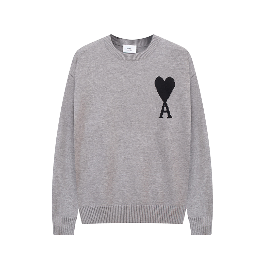 Pullover uomo con motivo cuore, texture morbida, colore grigio e taglio comodo, perfetto per look casual ed eleganti.