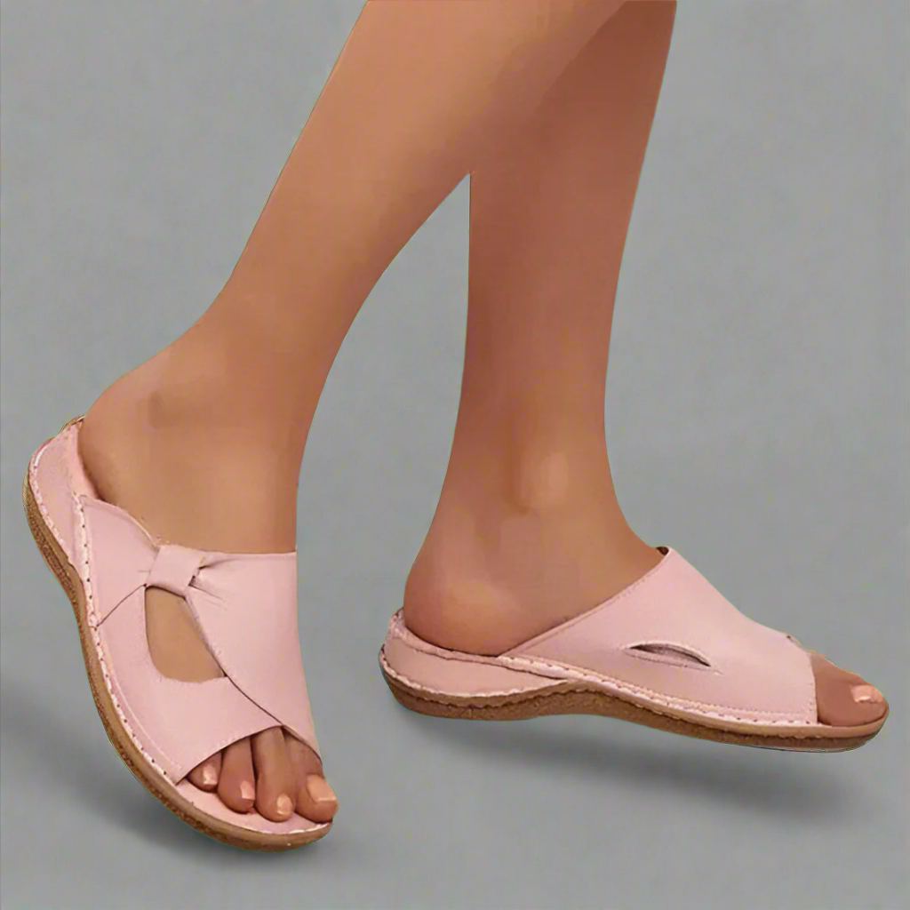"Sandali ortopedici da donna in pelle rosa con design elegante, comfort superiore e dettagli raffinati."