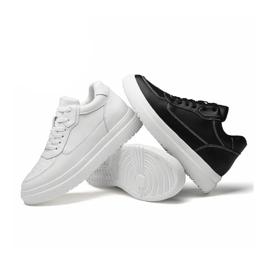 "Sneaker uomo nere-bianche, aumento invisibile, design elegante, comfort imbottito, ideali per look moderni quotidiani."
