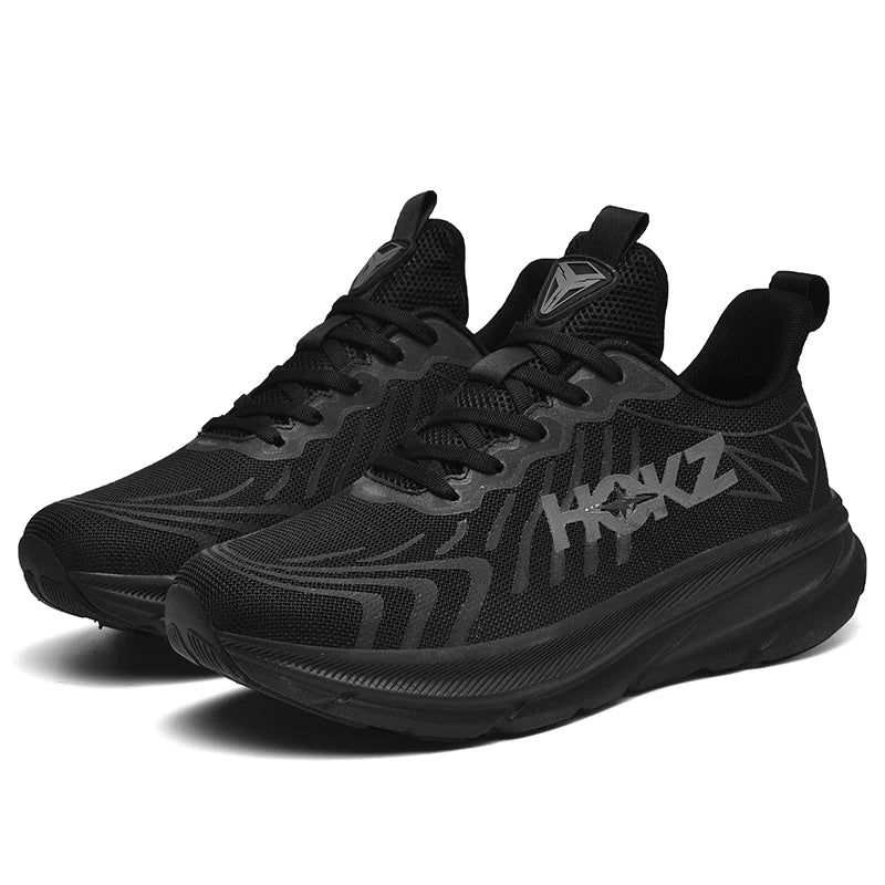 "Sneakers unisex con tecnologia SpringTech, design moderno nero, suola a molla visibile, ideali per sport e attività quotidia