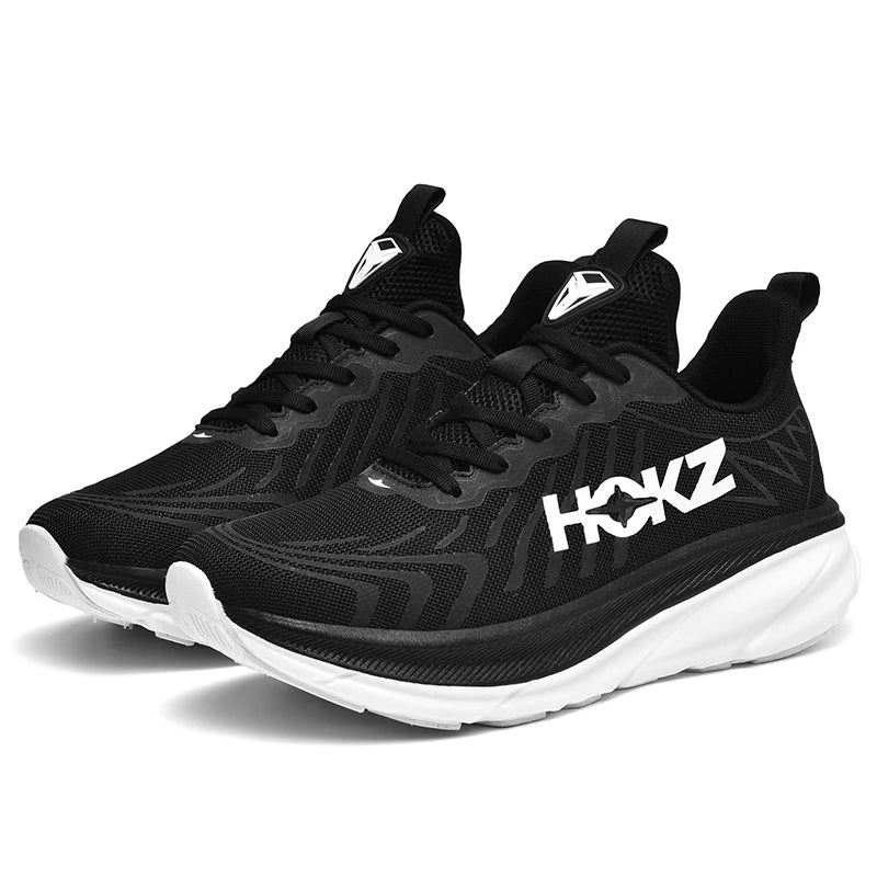"Sneakers unisex con tecnologia SpringTech, design moderno nero, suola a molla visibile, ideali per sport e attività quotidia