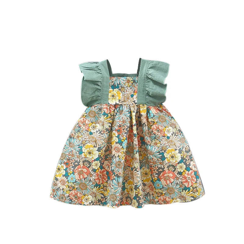 "Vestito floreale da bambina in cotone con cappello giallo, ideale per l'estate, perfetto per look eleganti e freschi."