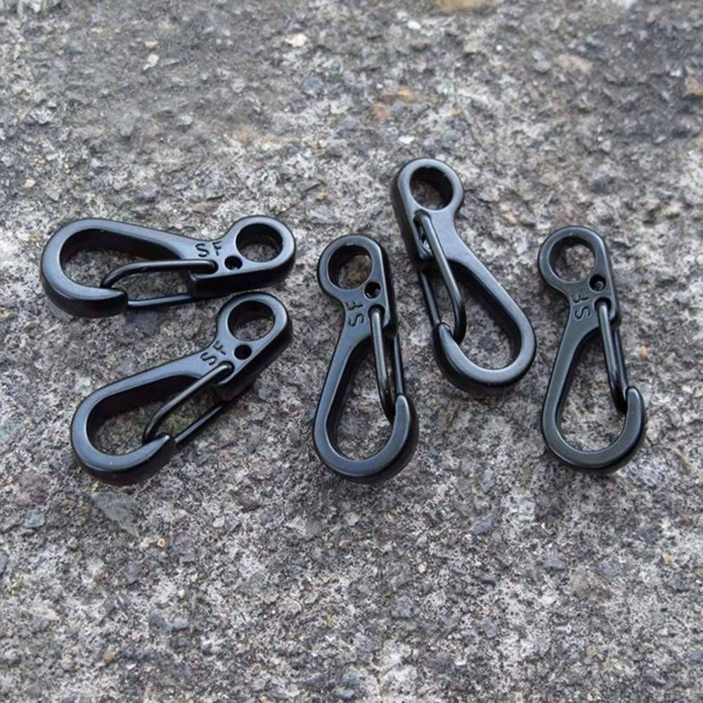 Mini SF carabiner being used as a keychain clip, demonstrating its practical, compact design