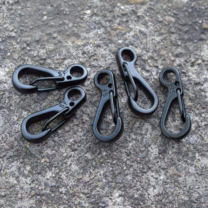 Mini SF carabiner being used as a keychain clip, demonstrating its practical, compact design
