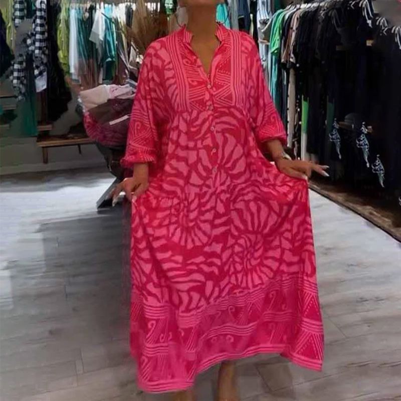 "Abito ampio donna collo V stampa vivace e colori brillanti, perfetto per look eleganti e confortevoli."