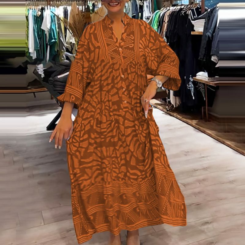 "Abito ampio donna collo V stampa vivace e colori brillanti, perfetto per look eleganti e confortevoli."