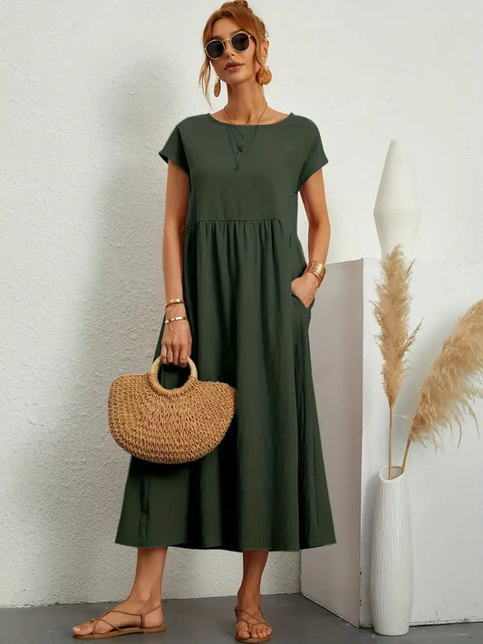 "Abito donna elegante in lino con tasche, colorato e versatile, per un look sofisticato e comodo in ogni stagione."