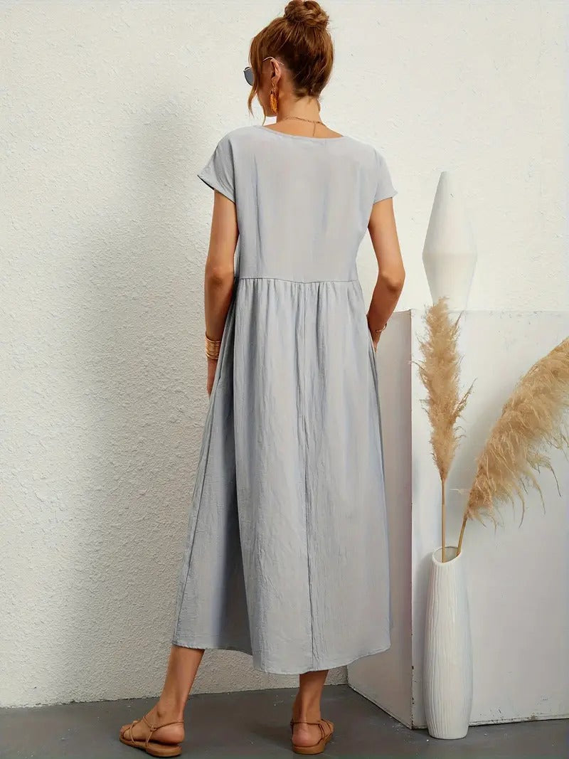 "Abito donna elegante in lino con tasche, colorato e versatile, per un look sofisticato e comodo in ogni stagione."