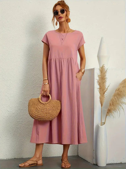 "Abito donna elegante in lino con tasche, colorato e versatile, per un look sofisticato e comodo in ogni stagione."