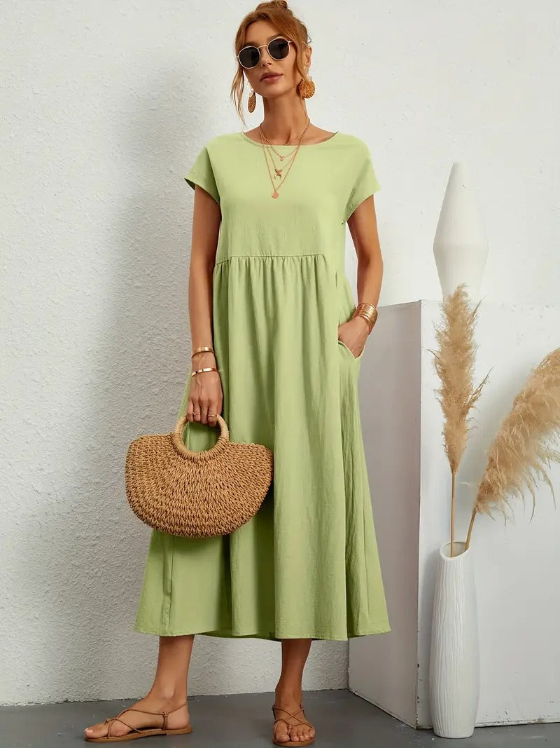 "Abito donna elegante in lino con tasche, colorato e versatile, per un look sofisticato e comodo in ogni stagione."