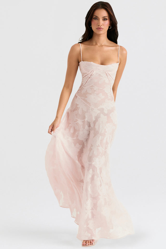 "Abito donna in pizzo lamé rosa semi-trasparente con motivi floreali e spalline rouleau, elegante per eventi glamour."