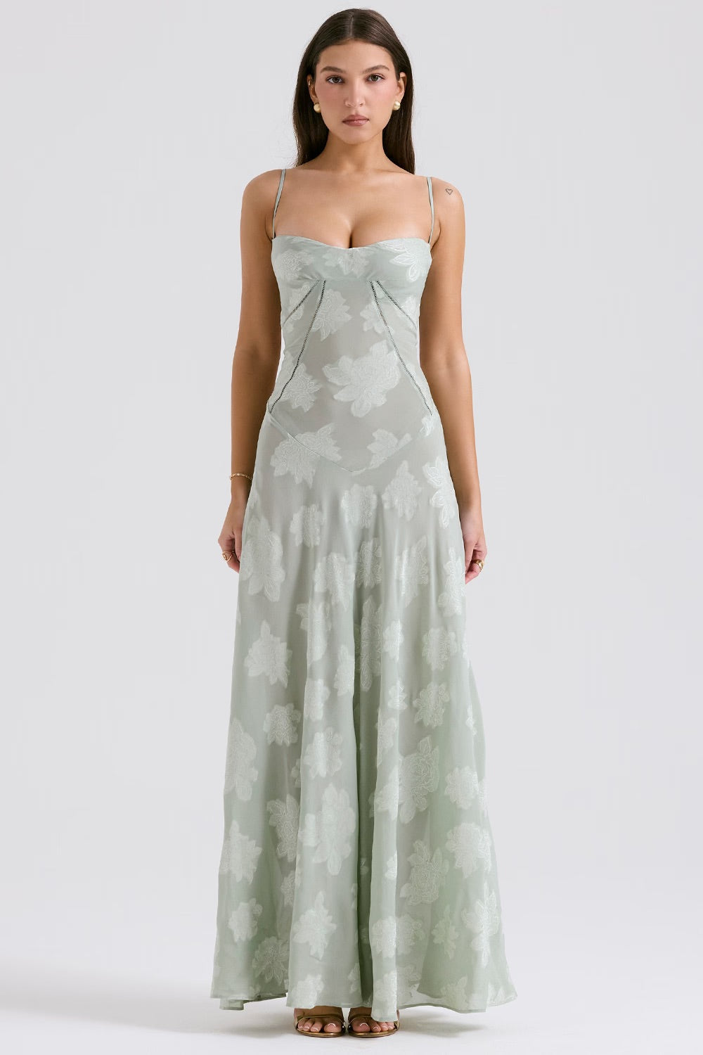 "Abito donna in pizzo lamé rosa semi-trasparente con motivi floreali e spalline rouleau, elegante per eventi glamour."