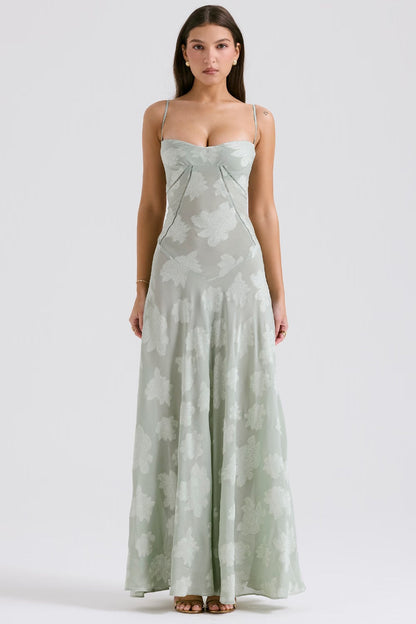 "Abito donna in pizzo lamé rosa semi-trasparente con motivi floreali e spalline rouleau, elegante per eventi glamour."
