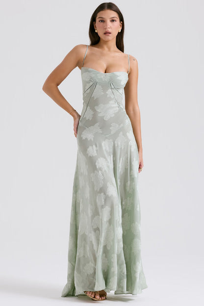 "Abito donna in pizzo lamé rosa semi-trasparente con motivi floreali e spalline rouleau, elegante per eventi glamour."