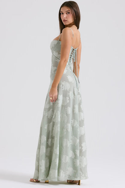 "Abito donna in pizzo lamé rosa semi-trasparente con motivi floreali e spalline rouleau, elegante per eventi glamour."
