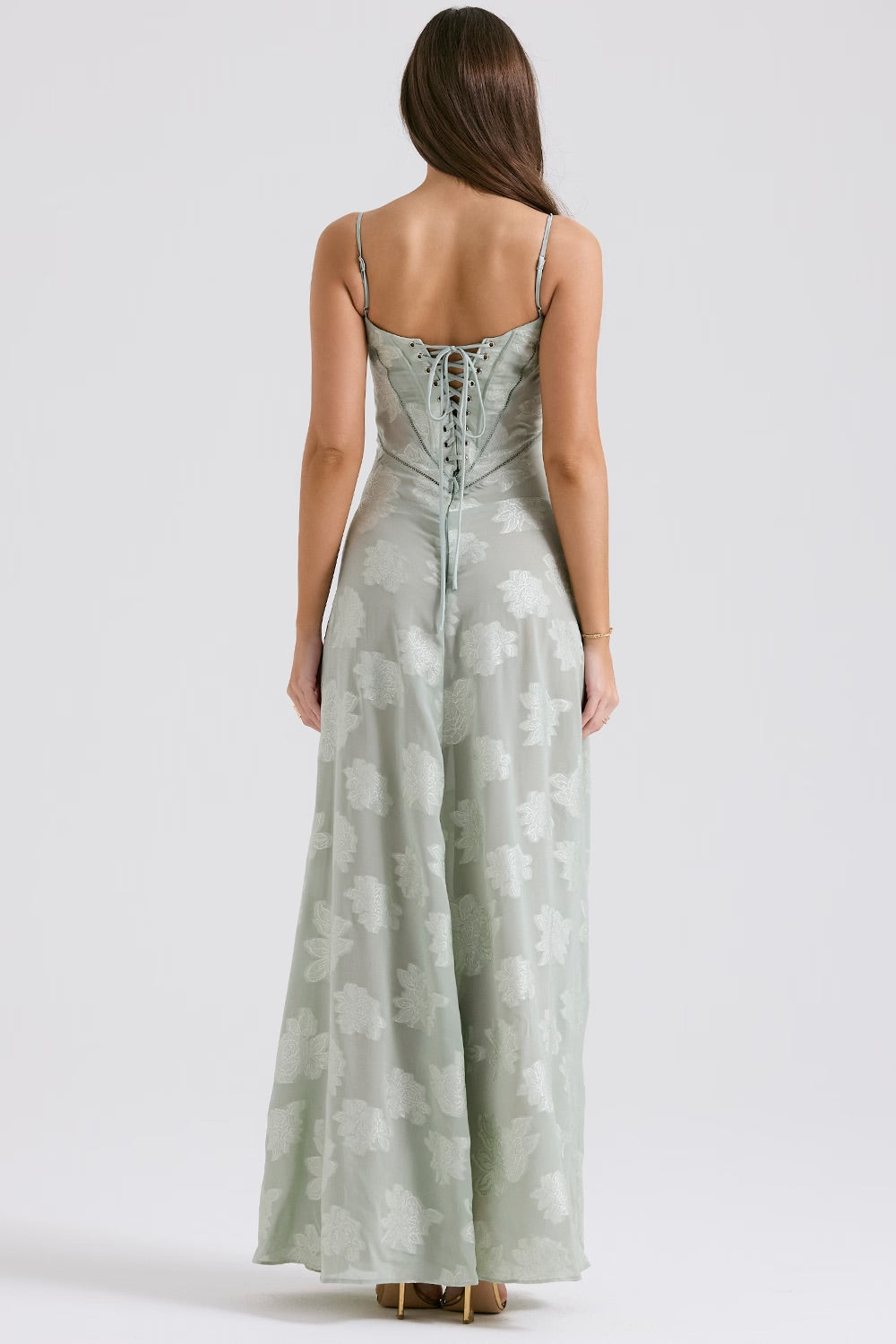 "Abito donna in pizzo lamé rosa semi-trasparente con motivi floreali e spalline rouleau, elegante per eventi glamour."