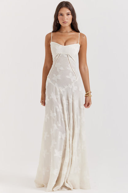 "Abito donna in pizzo lamé rosa semi-trasparente con motivi floreali e spalline rouleau, elegante per eventi glamour."