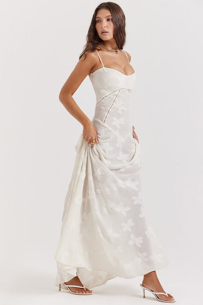 "Abito donna in pizzo lamé rosa semi-trasparente con motivi floreali e spalline rouleau, elegante per eventi glamour."