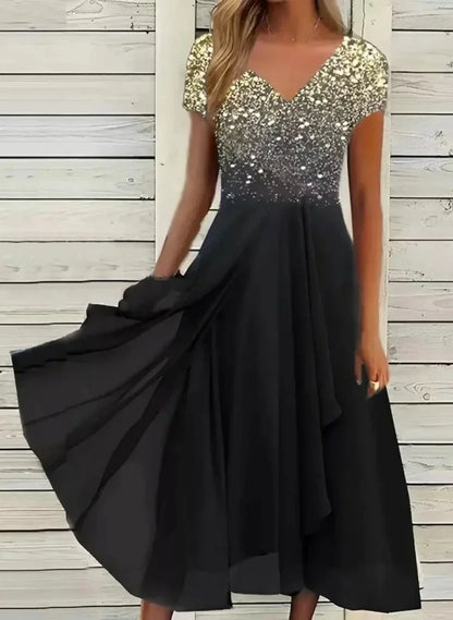 "Abito elegante donna con design floreale, tessuto morbido, colori vivaci, ideale per occasioni formali e casual."