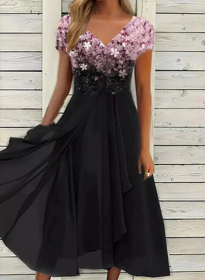 "Abito elegante donna con design floreale, tessuto morbido, colori vivaci, ideale per occasioni formali e casual."
