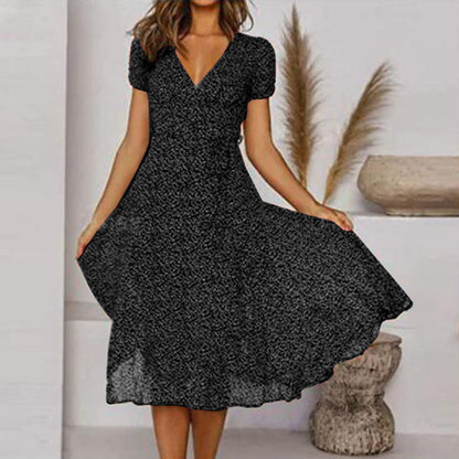 "Abito estivo donna A-line, scollo a V, senza maniche, colori vivaci, design fluido per un look fresco ed elegante."