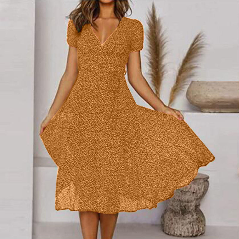 "Abito estivo donna A-line, scollo a V, senza maniche, colori vivaci, design fluido per un look fresco ed elegante."