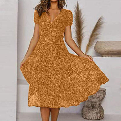 "Abito estivo donna A-line, scollo a V, senza maniche, colori vivaci, design fluido per un look fresco ed elegante."