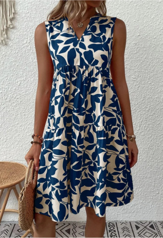 Abito estivo donna A-linea senza maniche con stampa floreale vivace, tessuto leggero e scollo rotondo elegante.