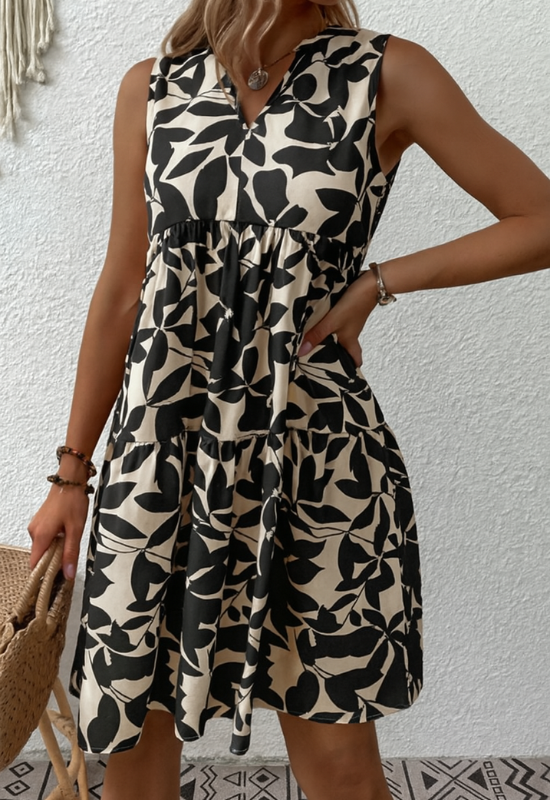 Abito estivo donna A-linea senza maniche con stampa floreale vivace, tessuto leggero e scollo rotondo elegante.