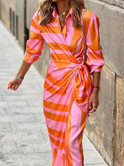 "Abito estivo donna con stampa colorata, tessuto leggero, perfetto per giornate calde, scollo rotondo o a V."