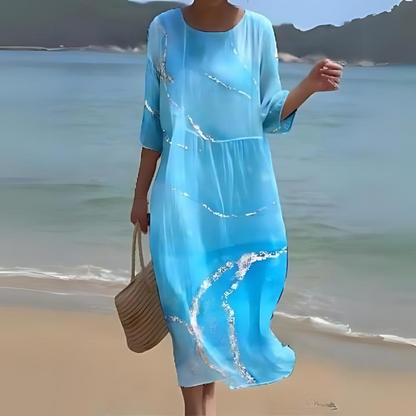"Abito estivo floreale da donna elegante con stampa floreale delicata, in cotone leggero e vestibilità lusinghiera."