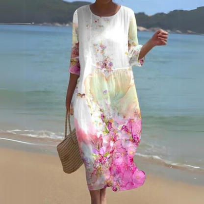 "Abito estivo floreale da donna elegante con stampa floreale delicata, in cotone leggero e vestibilità lusinghiera."