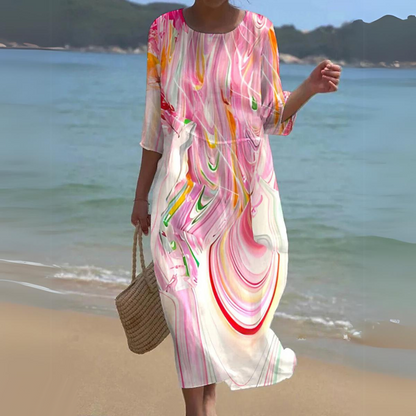 "Abito estivo floreale da donna elegante con stampa floreale delicata, in cotone leggero e vestibilità lusinghiera."