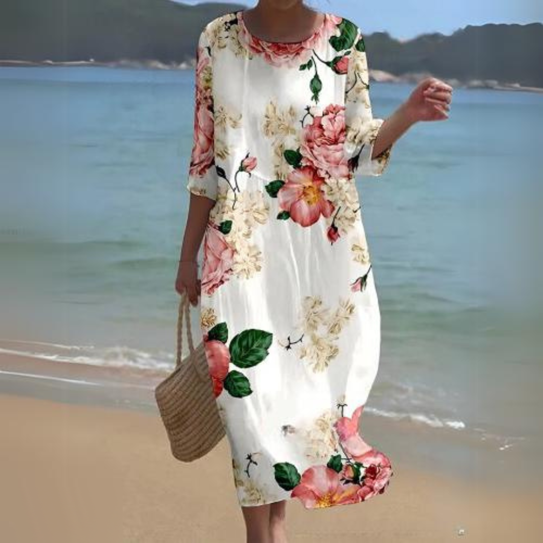 "Abito estivo floreale da donna elegante con stampa floreale delicata, in cotone leggero e vestibilità lusinghiera."