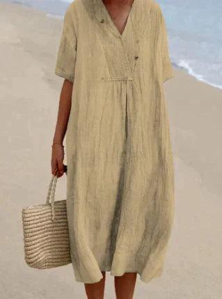 "Abito estivo in lino con scollo a V e maniche corte, perfetto per look casual ed eleganti. Disponibile in colori versatili."