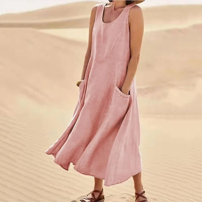 "Abito estivo in lino donna, design rilassato con tasche voluminose, perfetto per un look chic e confortevole."