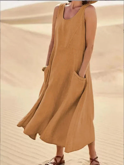 "Abito estivo in lino donna, design rilassato con tasche voluminose, perfetto per un look chic e confortevole."