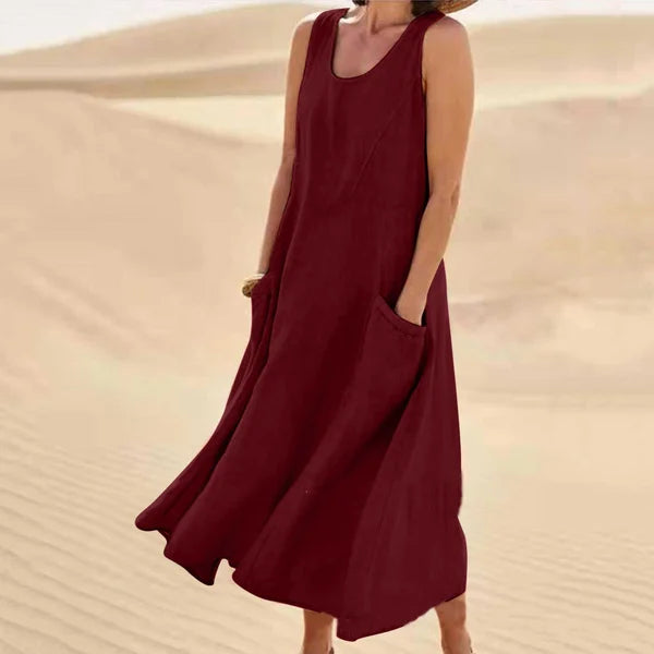 "Abito estivo in lino donna, design rilassato con tasche voluminose, perfetto per un look chic e confortevole."