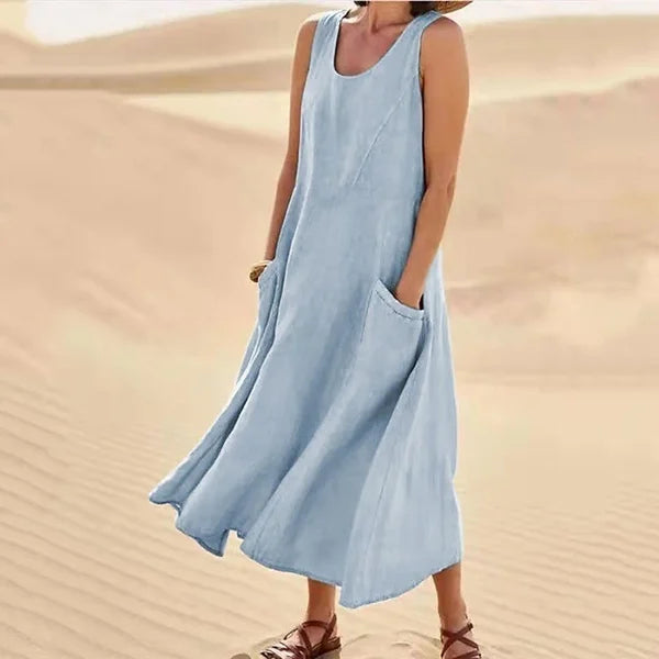 "Abito estivo in lino donna, design rilassato con tasche voluminose, perfetto per un look chic e confortevole."