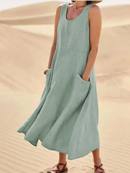 "Abito estivo in lino donna, design rilassato con tasche voluminose, perfetto per un look chic e confortevole."